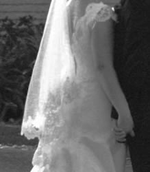 Black and white photograph of a gown from behind